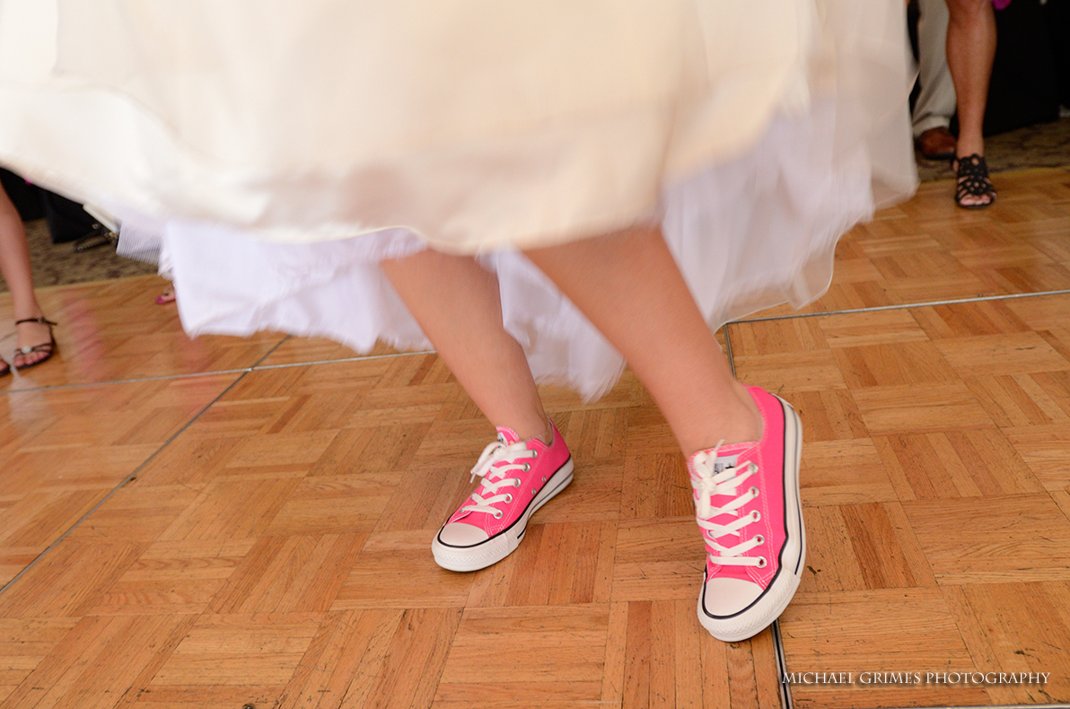 pink tennis shoes on the brides feet